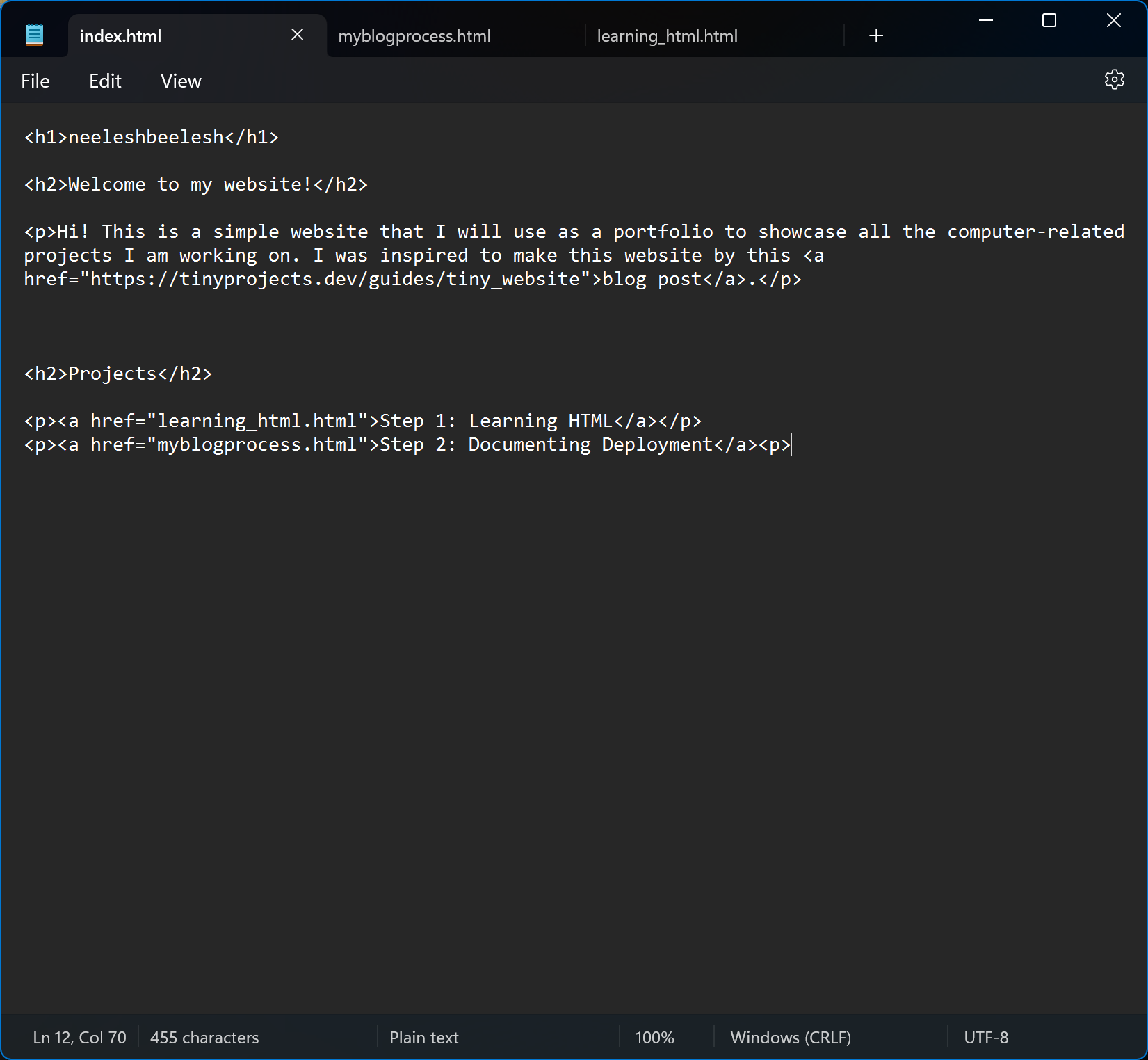 An image of Windows Notepad with an in-progress version of the HTML file for my website landing page